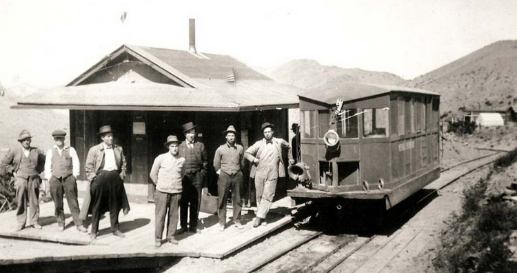 Nevada Short Line's motor car at Upper Rochester, fall of 1915. Third from left is Arthur A. Codd, NSL President and a Regent of the University of Nevada.